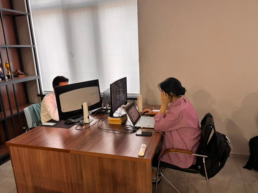 Colleagues at neighbouring desks in the office