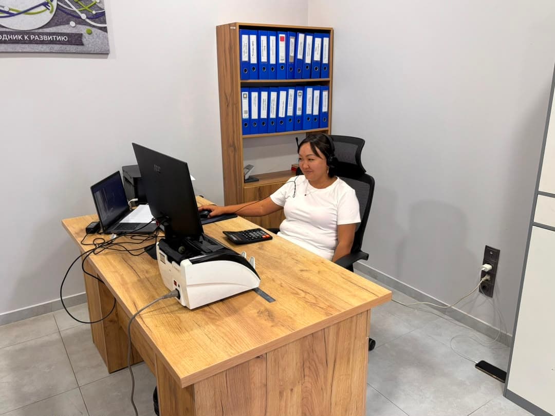 Team member on a headset talking to clients